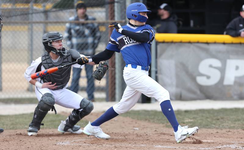 Burlington Central's Elliot Alecia watches as his ball travels to left field during their game against Sycamore Tuesday, March 21, 2023, at Sycamore Community Park.