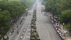 Military parade rolls through DC as ‘No Kings’ protesters across US decry Trump