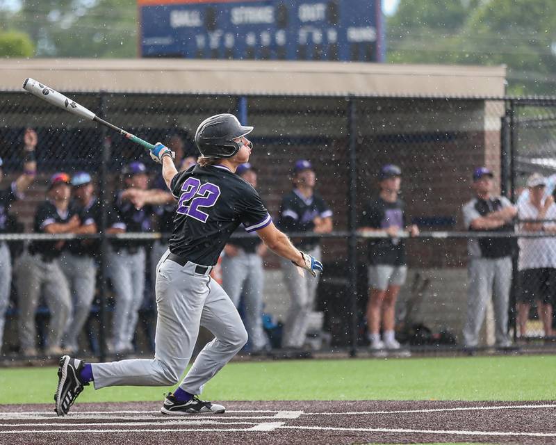 Downers Grove North's Ean Czech (22) watches his fly ball during Class 4A Romeoville Sectional semifinal between Oswego East at Downers Grove North.  May 31, 2023.