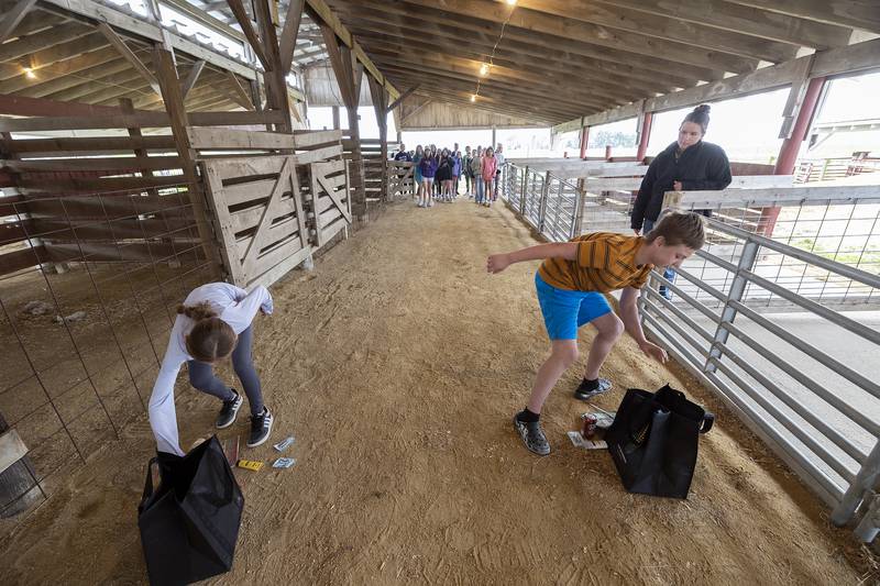 Fifth graders play a game of relay where they need to choose what everyday items have corn in them Friday, April 25, 2025, at Ag Expo.