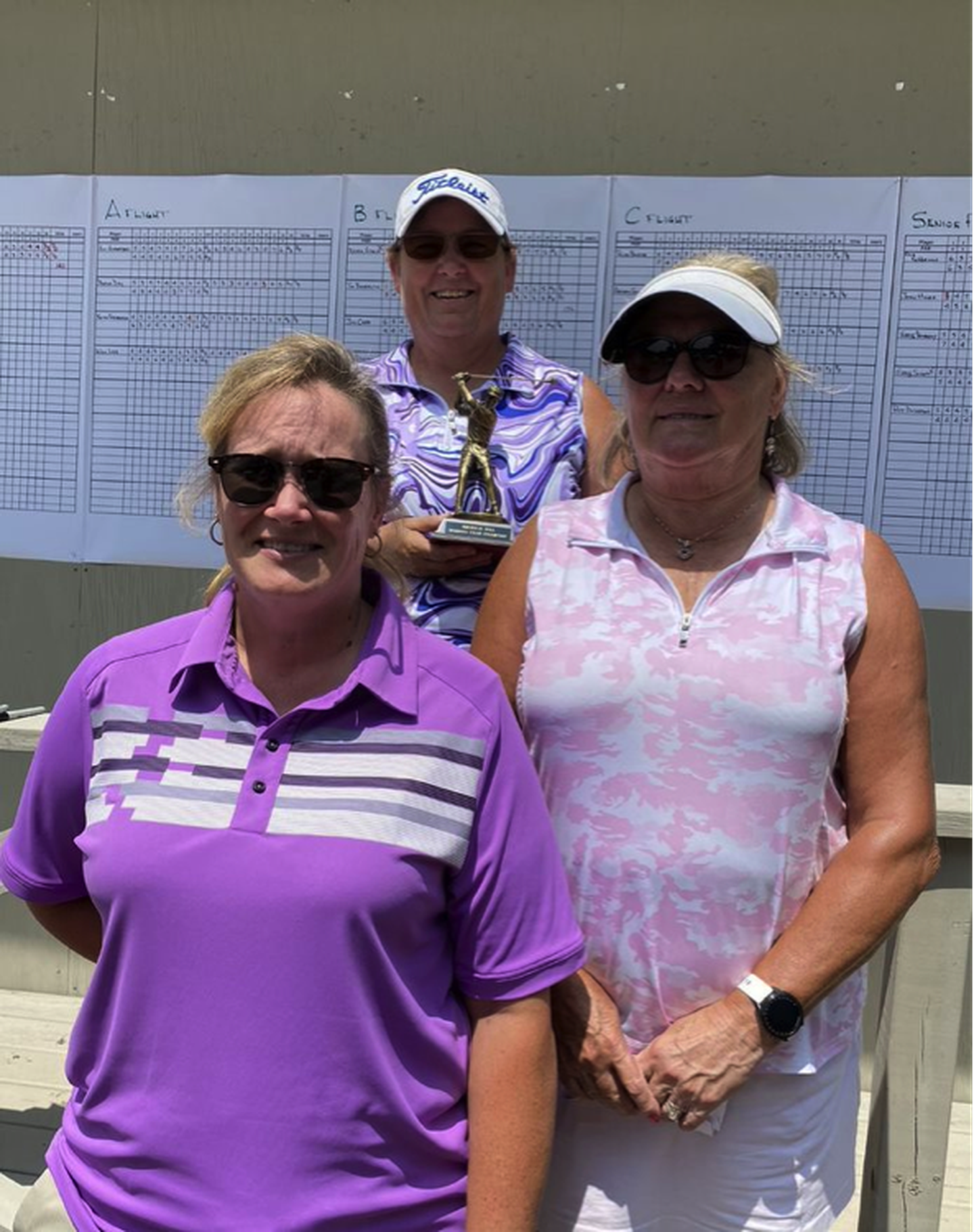 Medalists L. Adams (left), Joanna Sharp (middle) and Sandi Ivey (right) pose together after the women's championship flight of the Emerald Hill Golf Association Club Championship on July 23.