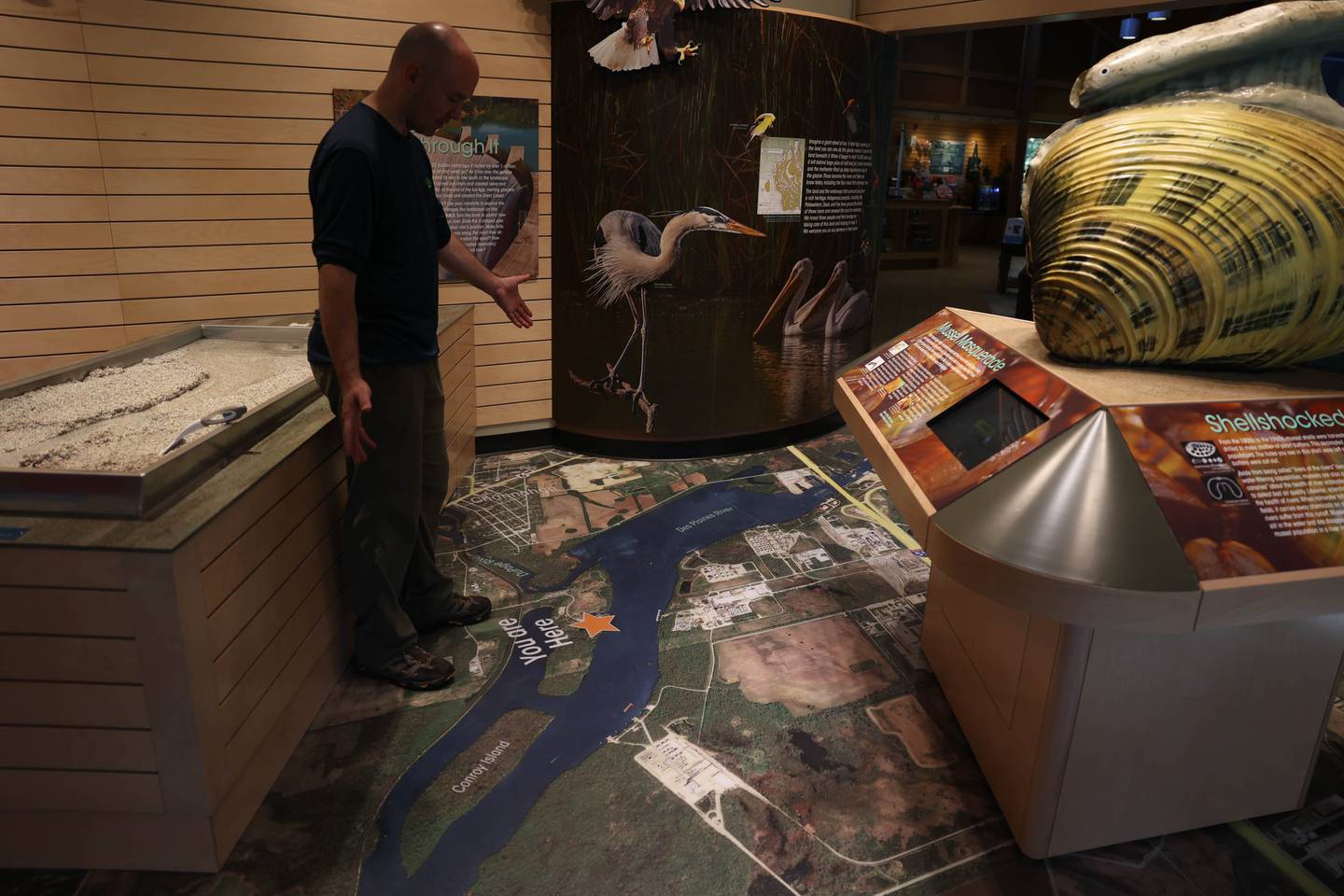 Jerome Gabriel Four Rivers Environmental Center Facility Supervisor points out the area floor map show all four of the area’s rivers. Tuesday, Sept. 20, 2022, in Channahon.