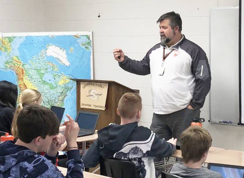 Dusty Behringer teaching his sixth grade social studies class Monday March 20, 2023, at Sandwich Middle School.