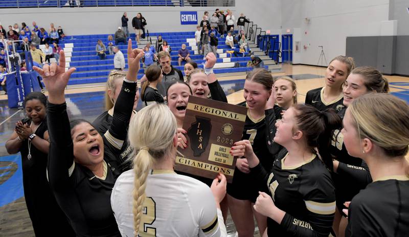 Sycamore celebrates winning the Class 3A Burlington Central Girls Volleyball Regional over Central on Thursday, Oct. 26, 2023.