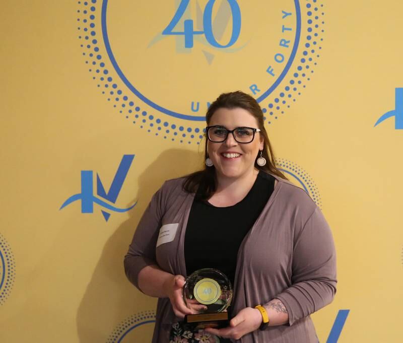 Kelsey Sarver poses for a photo with her award during the 40 Under Forty awards banquet on Thursday, March 21, 2024 at Westclox in Peru.