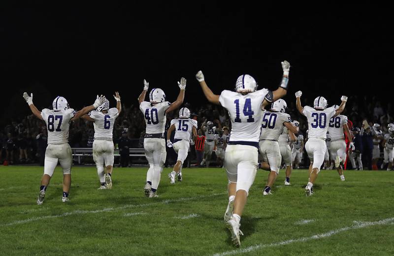 The Cary-Grove defense celebrates stoping the Prairie Ridge offense one yard short of a first down to seal their victory over Prairie Ridge in a Fox Valley Conference football game on Friday, Sept. 27, 2024, at Prairie Ridge High School.