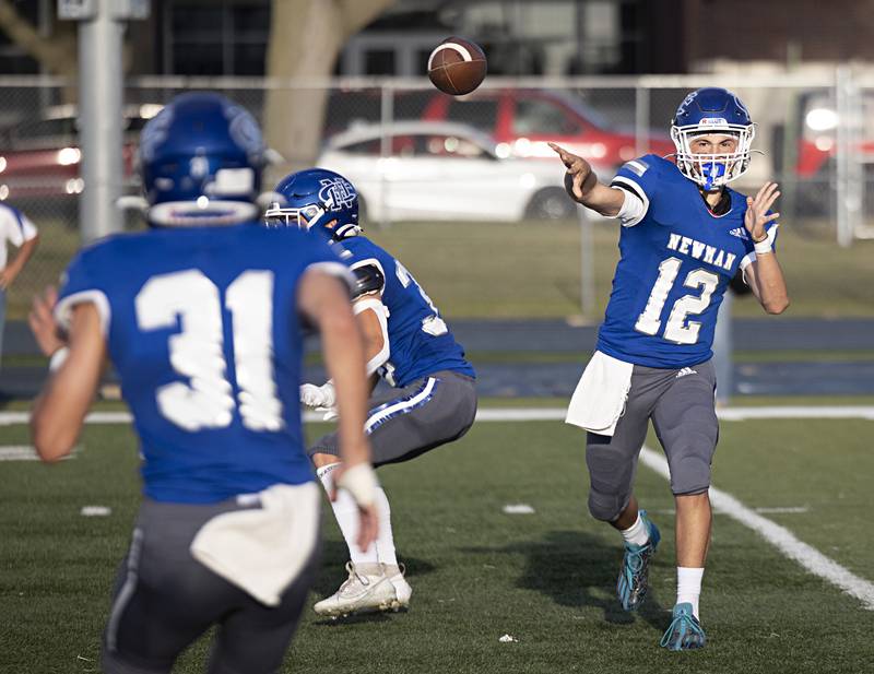 Newman’s Evan Bushman fires a pass out to Cody McBride in a game against Sherrard Saturday, Sept. 2, 2023 in a game at Sterling High School.