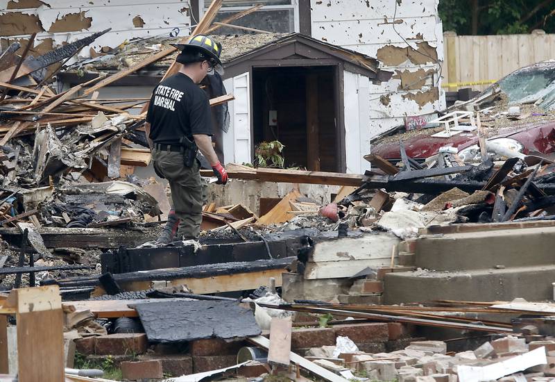Authorities look for the cause of a home explosion on Monday, May 18, 2026, in 7400 block of Birch Drive, in Wonder Lake, after the Sunday evening explosion. One resident of a home was killed and two others have been taken to the hospital.