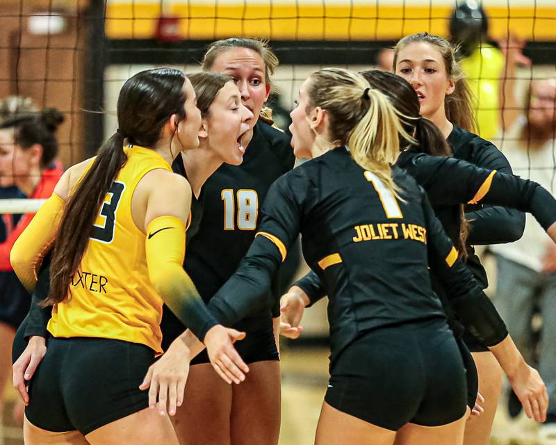 Joliet West celebrates a key point during volleyball match between Oswego at Joliet West.  Oct 19, 2023.