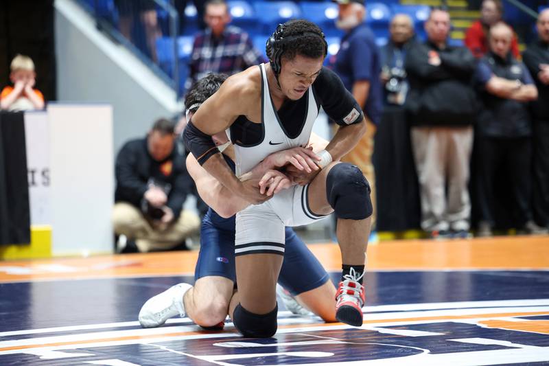 St. Charles East's Isaac Lenard wrestles against Oak Park-River Forest's Alex Albrecht in the 157-pound match to secure the win and the IHSA Class 3A Dual Team State third place title over Oak Park-River Forest on Saturday, Feb. 28, 2026.