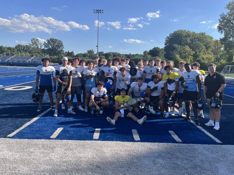 St. Francis senior quarterback Brock Phillip (gold jersey, center) is the Week 1 Friday Night Drive Team of the Week MVP.