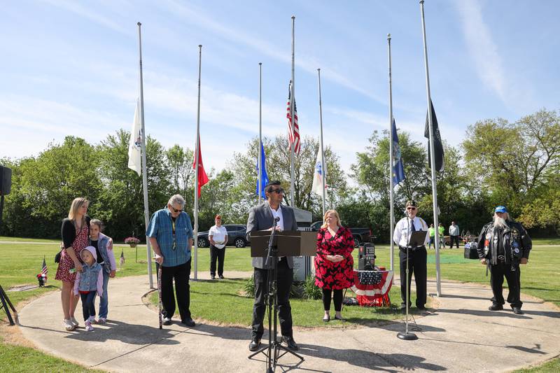 Jason Diaz, Army veteran and board member with veteran nonprofit Project Headspace and Timing, speaks during a ceremony dedicated to the late John Kirnbauer, a veteran whose ashes went unclaimed for five years, on Monday, May 26, 2025, at Kankakee Memorial Gardens.