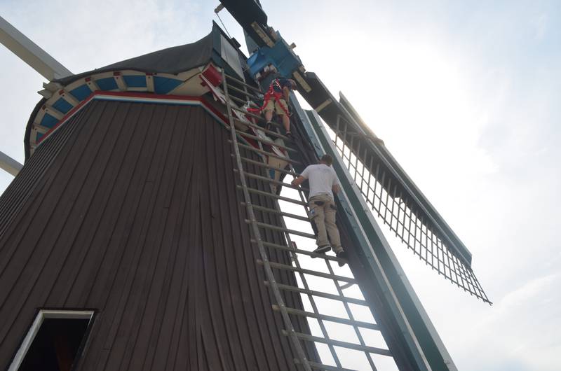 Johan van Dijk works on the sails at de Immigrant Windmill on Wednesday, July 26.