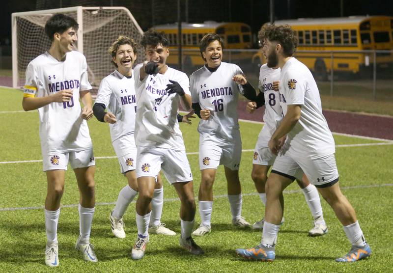 Members of the Mendota soccer team celebrate after scoring the first goal against Peoria Christian during the Class 1A Sectional game on Wednesday, Oct. 30, 2024 at Chillicothe High School.