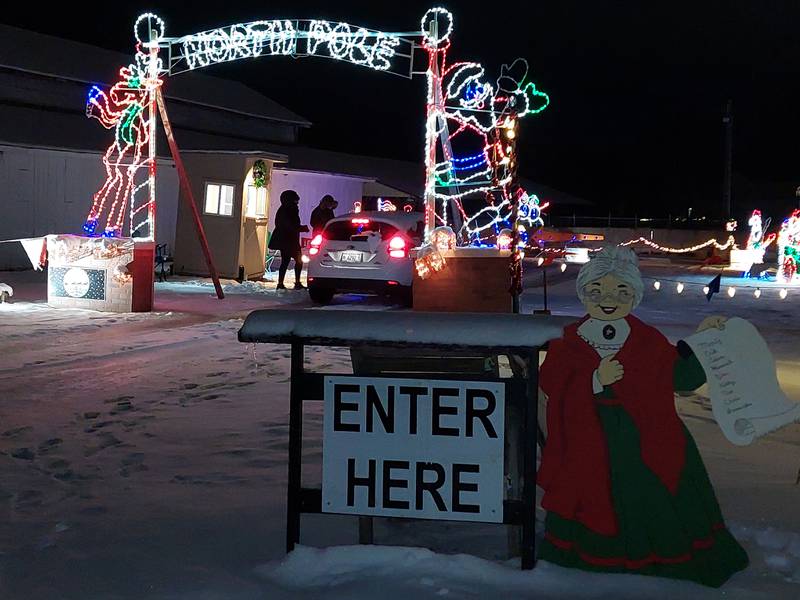 Cars travel through the entrance of the Home for the Holidays Light Show at the Bureau County Fairgrounds in Princeton.