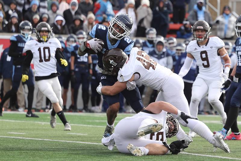 Joliet Catholic’s Derrick Pomatto puts a hit on Nazareth’s Garrett Reese in the Class 5A state championship on Saturday, Nov. 30, 2024 in Normal.