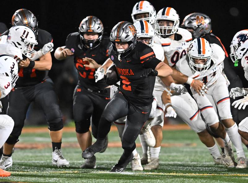Minooka's Chase Nurczyk (2) rushes the ball during the conference game against Oswego on Friday, OCT. 10, 2025, at Minooka.