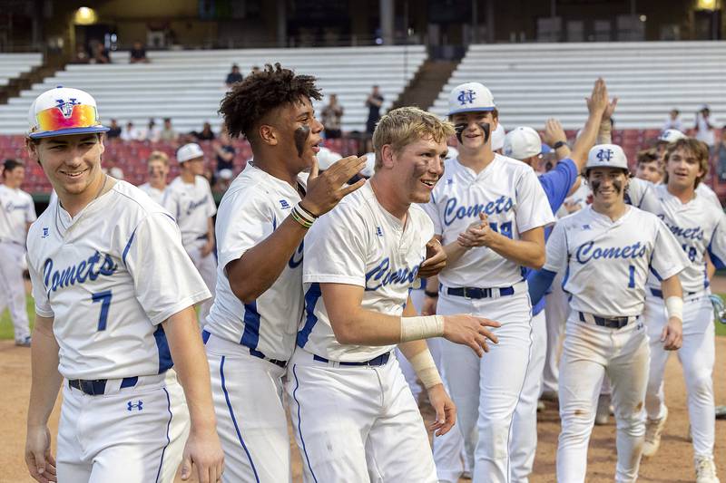 The Newman Comets celebrate their 5-1 win over Chicago Hope Monday, June 2, 2025, during the Class 2A Supersectional at Northwestern Medicine Field in Geneva.