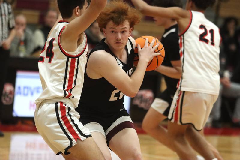 Prairie Ridge’s Jonathan Kemp navigates traffic in varsity boys basketball on Tuesday, Feb. 18, 2025, at  Huntley High School in Huntley.