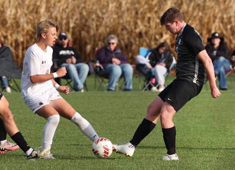 Sycamore's Gavin Crouch (left) and Kaneland's Riley Adams arrive at the ball at the same time during their game Monday, Oct. 7, 2024, at Kaneland High School in Maple Park.