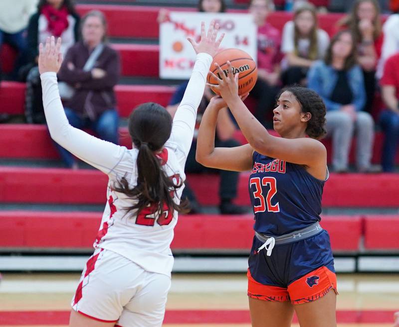 Oswego’s Ahlivia East (32) shoots a three pointer against Naperville Central during a basketball game at Naperville Central High School on Friday, Nov 17, 2023.