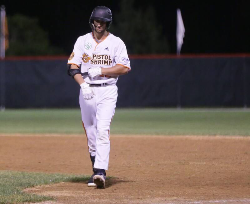 Pistol Shrimp's Evan Evola takes his arm band off after making the final out during the Eastern Conference Championship game on Tuesday, Aug, 9 2022 at Schweickert Stadium in Veterans Park in Peru.