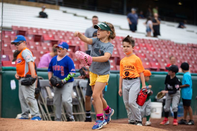 Aurelia Contreras (6) of Batavia practices pitching at the pitching station of the Kane County Cougar's Youth Clinic at Northwestern Medicine Field on Saturday, July 16, 2022.