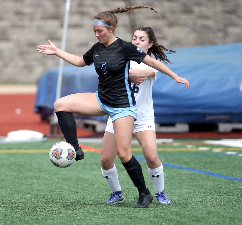 St. Charles North’s Leah Bellock gets control of the ball during a Naperville Invitational game against Oswego East at Naperville Central on Saturday, April 23, 2022.