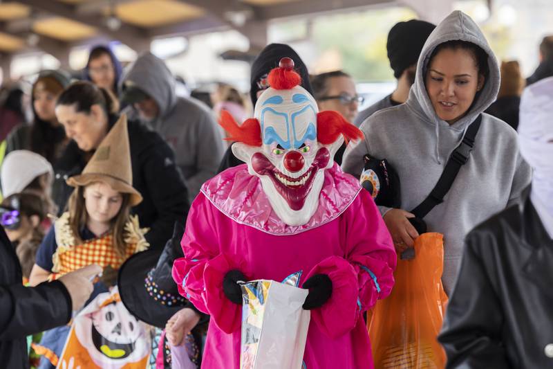 Creepy clowns and others made their way through the Sterling Police Department's trunk-or-treat Tuesday, Oct. 28, 2025. Hundreds poured through the Pavilion in Sterling to gobble up sweet treats.