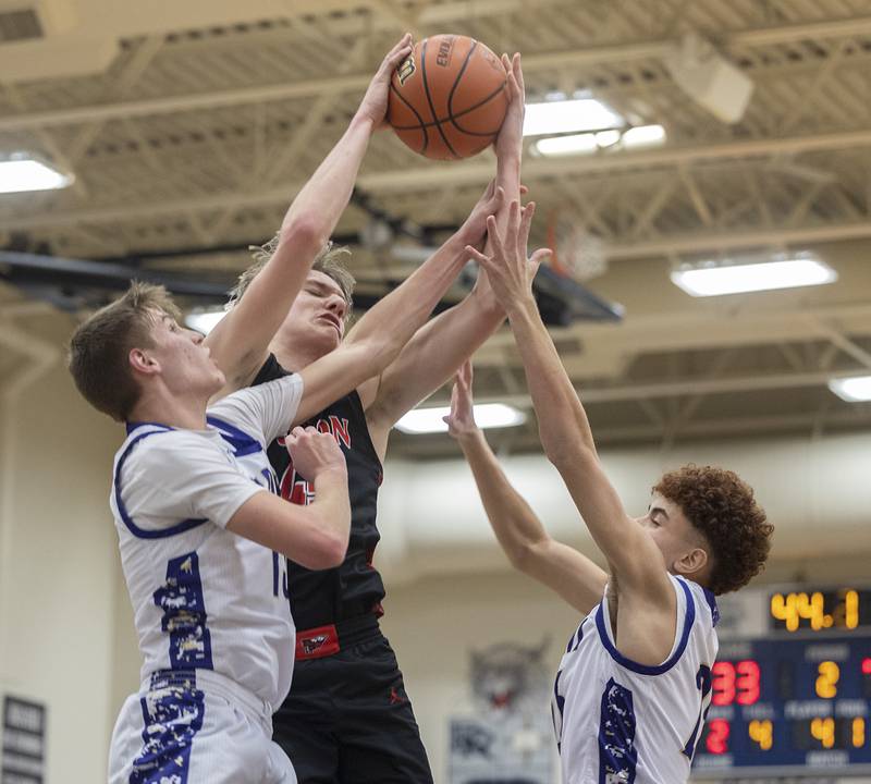 Fulton’s Landen Leu works below the basket against Pecatonica’s Jordan Gassman (left) and Joshua Jennings during a class 1A sectional semifinal Wednesday, Feb. 28, 2024 at River Ridge High School.