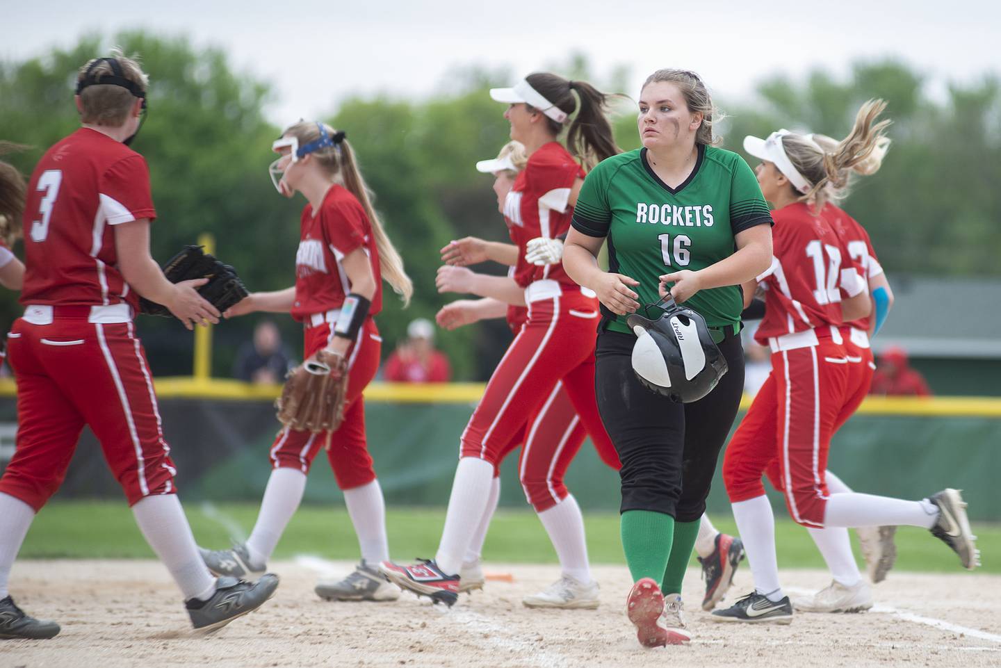 Rock Falls’ Zoe Morgan heads for the dugout after making the final out in the game against Oregon in the regional final Friday, May 20, 2022.