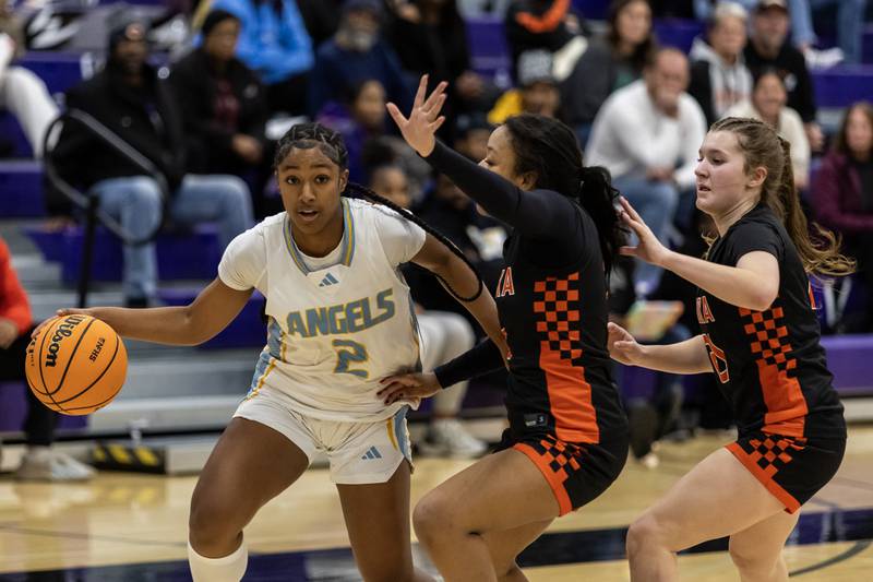 Joliet Catholic's Gabrielle Gavin makes a nice move during a WJOL Girls Basketball Tournament game against Minooka at Joliet Junior College on Nov. 17, 2025.