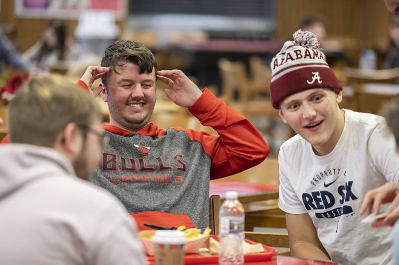 Corey Billings (left) and Kael Willis of Sterling are stunned at a card trick performed by Christopher Carter Wednesday, Nov. 16, 2022 at Sauk Valley Community College.