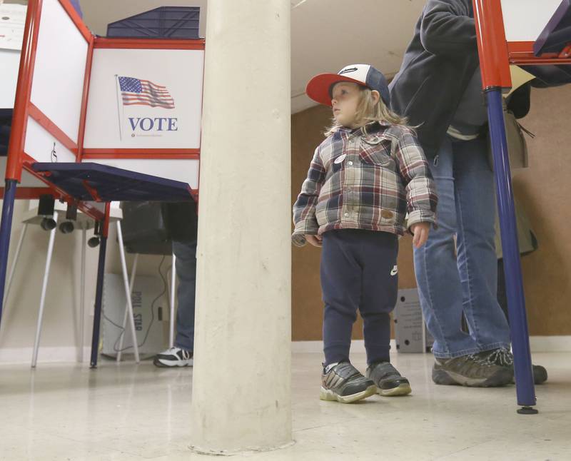 Future voter Ryan Klimick, looks around the polling place while his grandmaJane Knafelc votes on Tuesday, April 1, 2025 at Christ Family Four Square Church in La Salle.