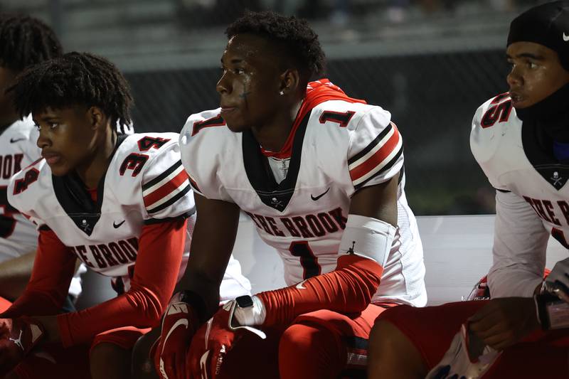 Bolingbrook’s Kyan Berry-Johnson sits on the bench between series against Lincoln-Way West on Friday, Sept. 22 in New Lenox.