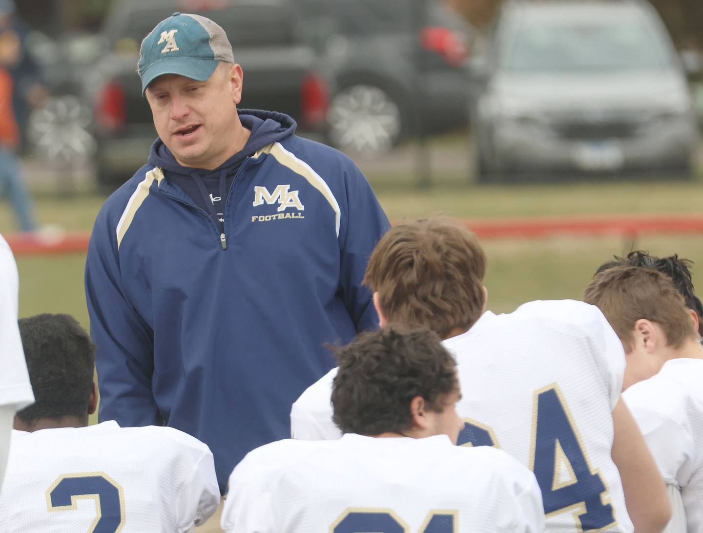 Marquette head football coach Ken Carlson talks to his team after loosing during the Class 1A playoff game on Saturday, Nov. 1, 2025 at Gibson City-Melvin-Sibley High School.
