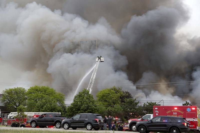 Emergency vehicles are lined up along the property bordering the site of the former Pheasant Run Resort on Saturday in St. Charles.