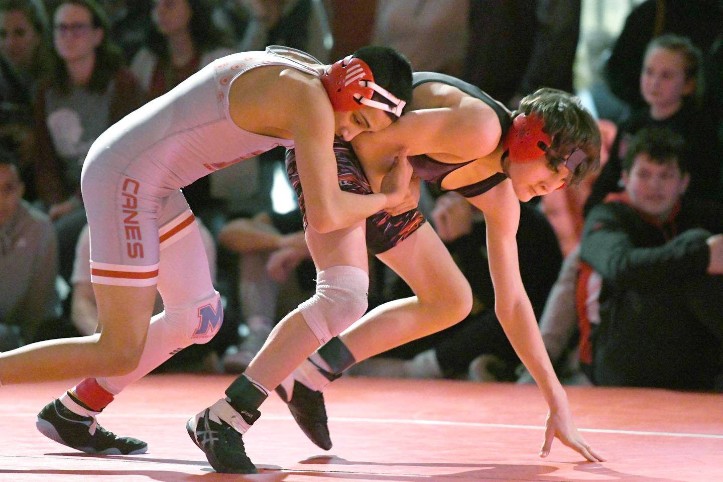 Woodstock Marian's Andrew Alvarado (left) wrestles Amboy's Landon Blanton of Amboy for the championship at 1113 pounds at the 1A Oregon Wrestling Sectional on Saturday. Alvardo won the match.