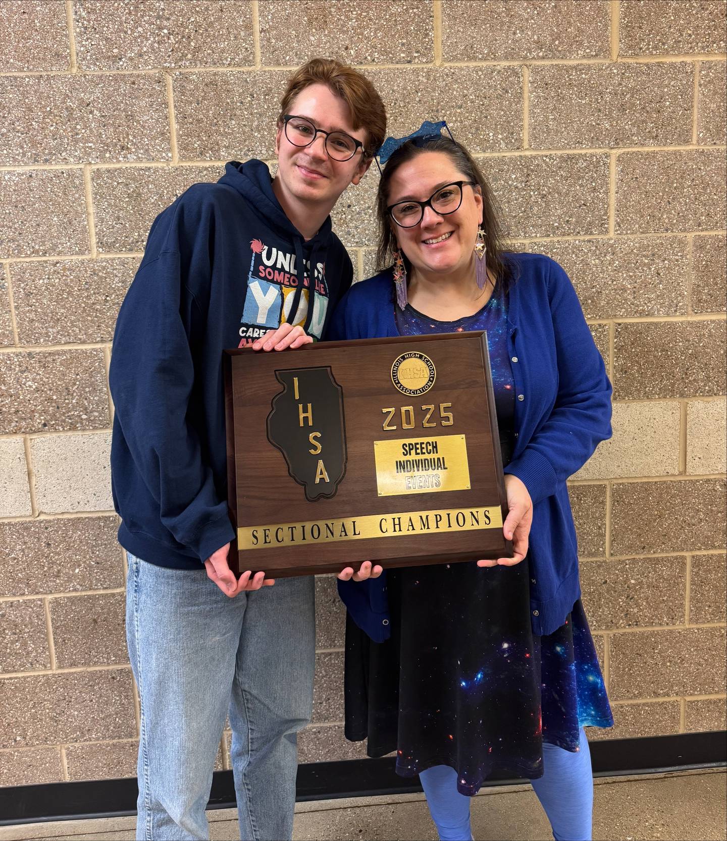 Joliet West speech team coaches Kristin Blake and Tony Nardi pose with the team's sectional championship trophy. 
Feb. 15. 2025