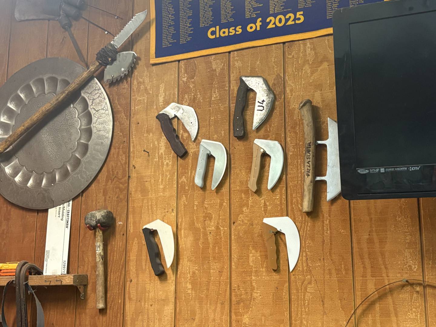 A collection of Ulu knives displayed in the garage workshop of Army veteran Doug Katz in Trout Valley.