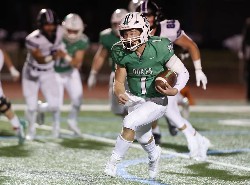 York's Bruno Massel (1) scrambles during the varsity football game between Downers Grove North and York on Friday, Oct. 4, 2024 in Elmhurst.