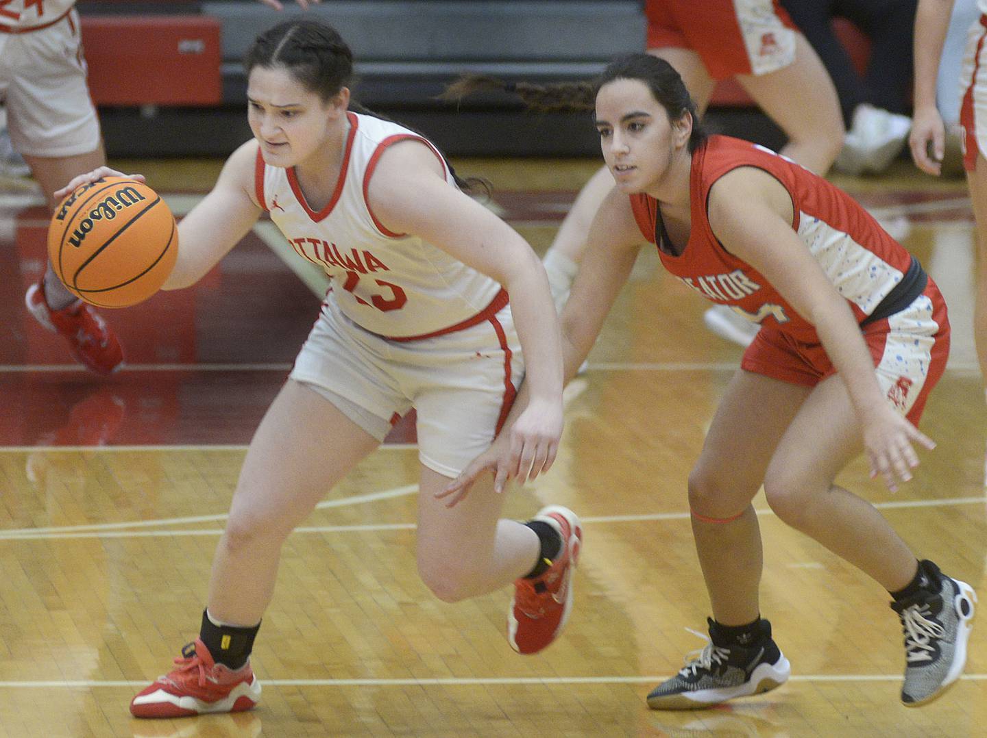 Ottawa’s Mary Stisser drives past Streator’s Isabel Gutierez after stealing the ball away in the 2nd period Thursday at Ottawa.
