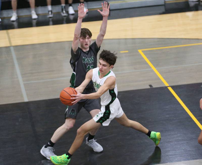 Seneca's Brayden Simek catches a pass in the lane while being guarded by Midland's Keagan Faulkner during the Tri-County Conference Tournament on Thursday, Jan. 25, 2024 at Putnam County HIgh School.