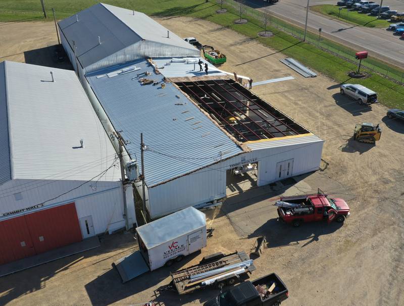 Crews from Vitale Construction work on replacing the roof of the exterior of the Exhibit Hall's 1 and 2 building on Wednesday, Nov. 8, 2023 at the Bureau County Fairgrounds in Princeton.