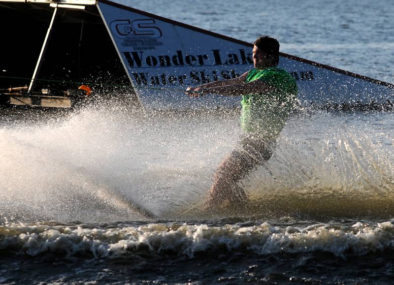 Stanley Nowiki water skis Tuesday, June 21, 2022, as part of the Wonder Lake Water Ski Show Team and Northern Illinois Special Recreation Association’s show on Wonder Lake. The performance was the end of the team’s learn to ski clinic. Members of ski team have constructed adaptive water ski equipment, which has proven year after year to be successful in allowing every participant to be able to water ski.