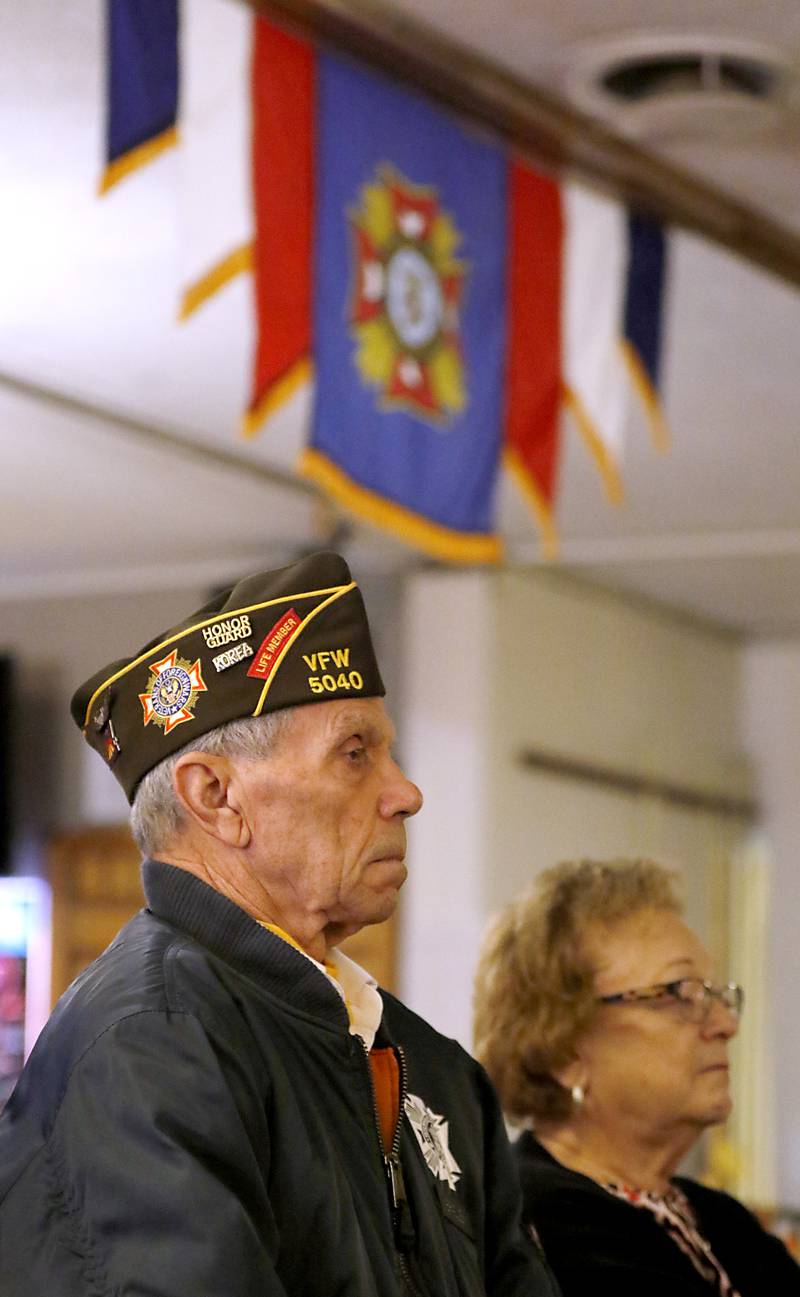 Honor Guard member Glynn Bradley listens to a speech during a Veterans Day ceremony Friday Nov. 11, 2022, at the Woodstock Veterans of Foreign Wars Post 5040, 240 N. Throop St. The ceremony featured speeches by Woodstock Mayor Michael Turner and Post Cmdr. Fred Strauss, taps, a 21-gun salute and a luncheon.