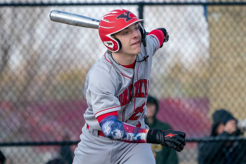 Yorkville's Joe Onasch (25) singles against Marmion during a baseball game at Marmion High School in Aurora on Tuesday, Mar 28, 2023.