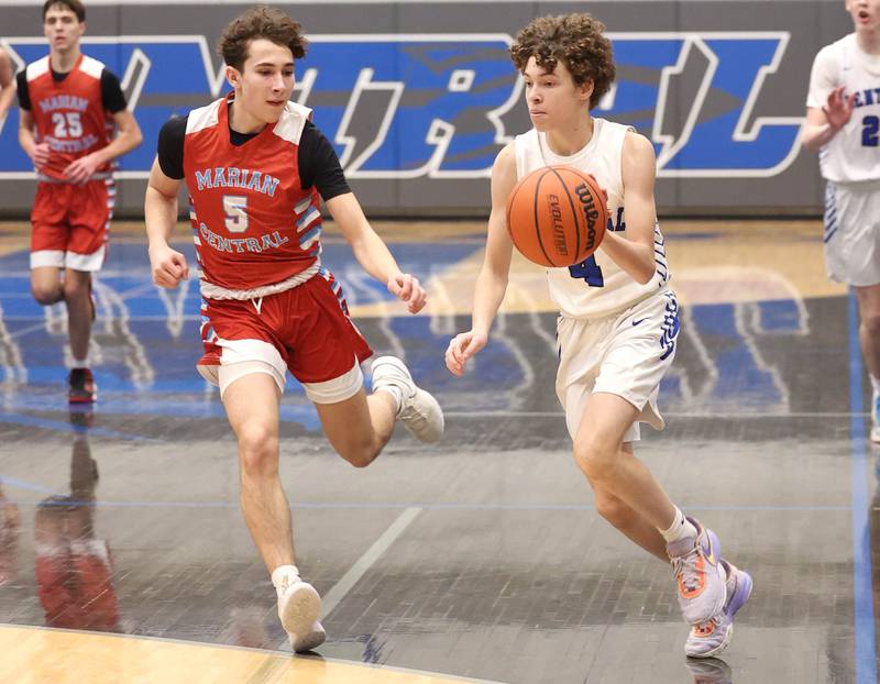 Burlington Central's Ryan Carpenter pushes the ball ahead of Marian Central's Andrew Dovidio Monday, Jan. 15, 2023, during their game in the Burlington Central Martin Luther King Jr. boys basketball tournament.