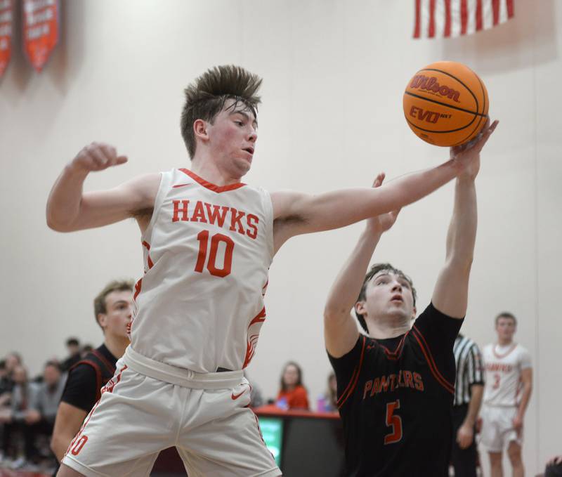Oregon's Keaton Salsbury (10) and Erie-Prophetstown's Max Milem (5) fight for a rebound on Monday, Feb. 24, 2025 in 2A regional action at the Blackhawk Center in Oregon.