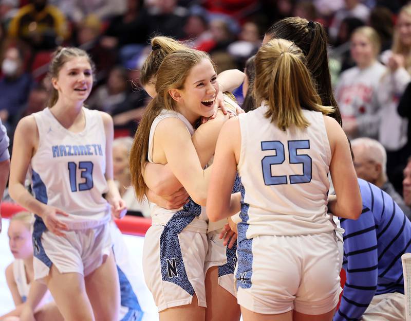 Nazareth Academy celebrates their win over Lincoln during the IHSA Class 3A girls basketball championship game at the CEFCU Arena on the campus of Illinois State University Saturday March 4, 2023 in Normal.